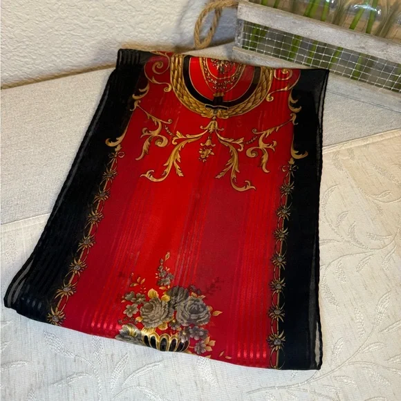 Red, black, and gold silk scarf with floral, filagree and vase motif. 53” x 10” - Picture 5 of 7